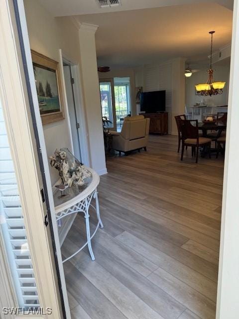 interior space featuring light wood-type flooring and visible vents