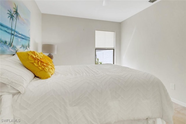 bedroom featuring baseboards