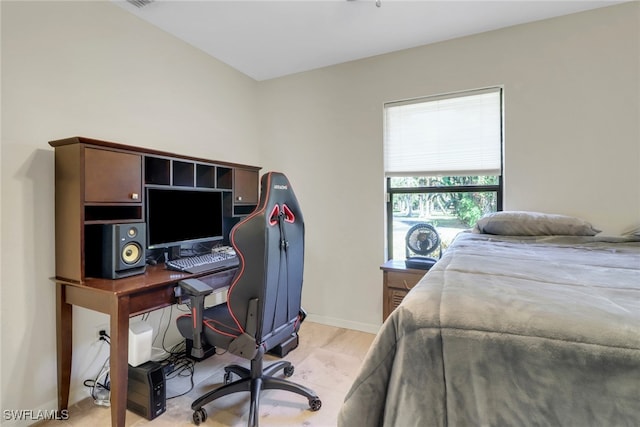 bedroom featuring light wood-style floors and baseboards