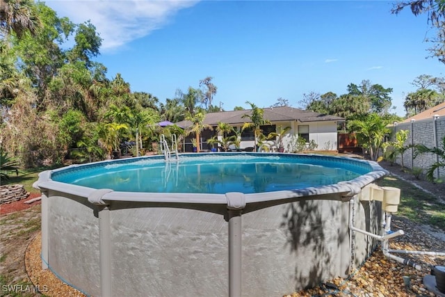 pool with a fenced backyard