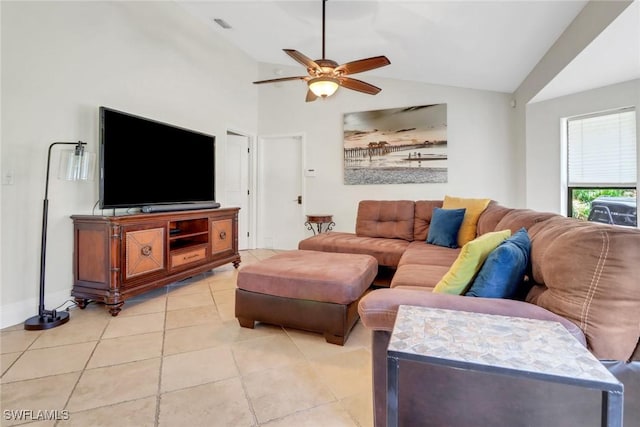 living room featuring ceiling fan, visible vents, vaulted ceiling, and light tile patterned floors