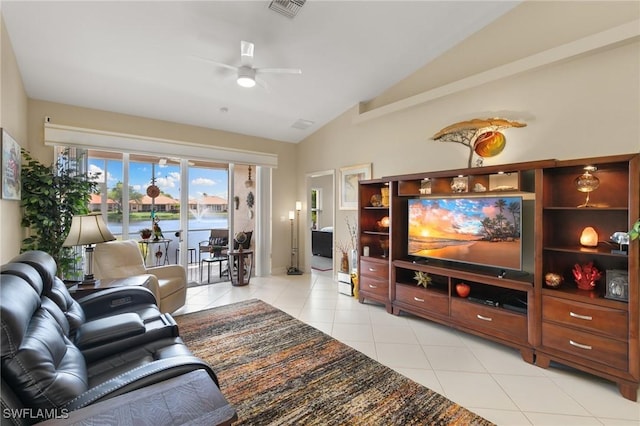 living room featuring vaulted ceiling, a ceiling fan, visible vents, and light tile patterned floors