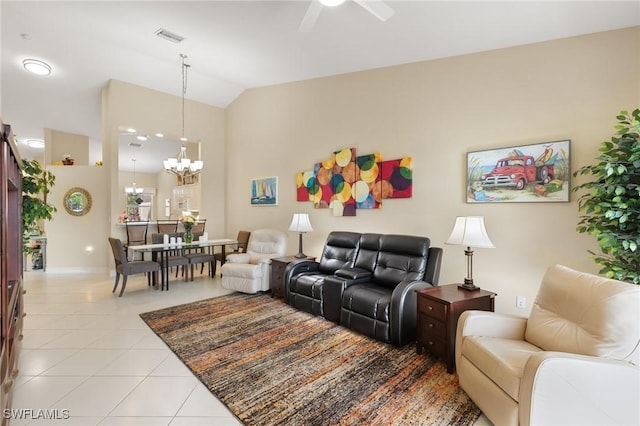 living area with light tile patterned floors, vaulted ceiling, ceiling fan with notable chandelier, and visible vents