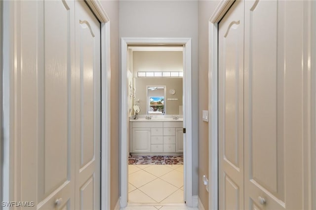 corridor with light tile patterned flooring