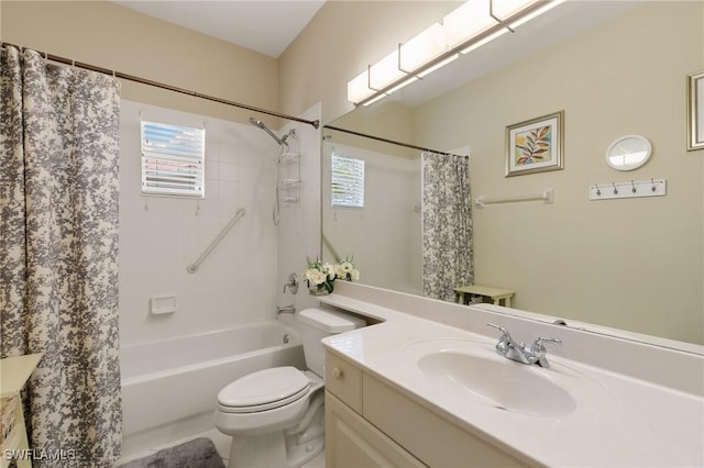 full bathroom with shower / bath combo, vanity, and toilet