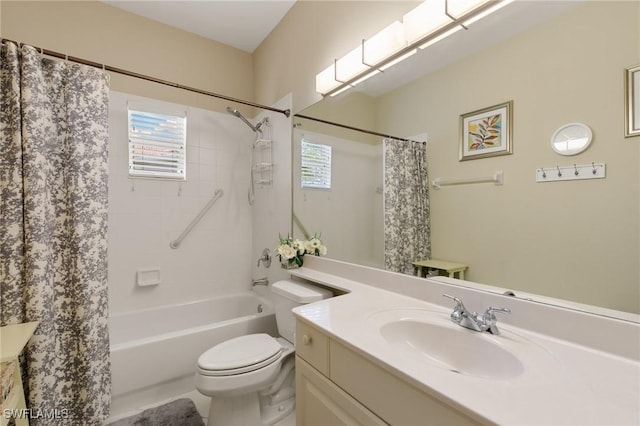 full bathroom featuring plenty of natural light, vanity, and toilet