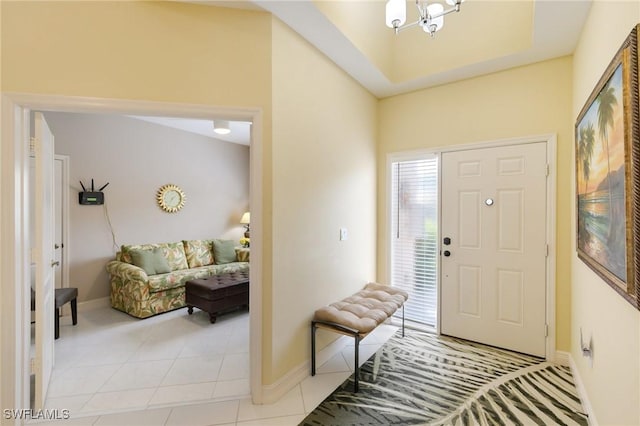 entrance foyer with baseboards and light tile patterned floors