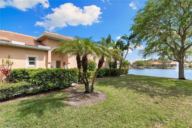 view of yard with a water view