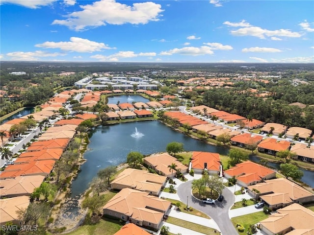 birds eye view of property with a water view and a residential view