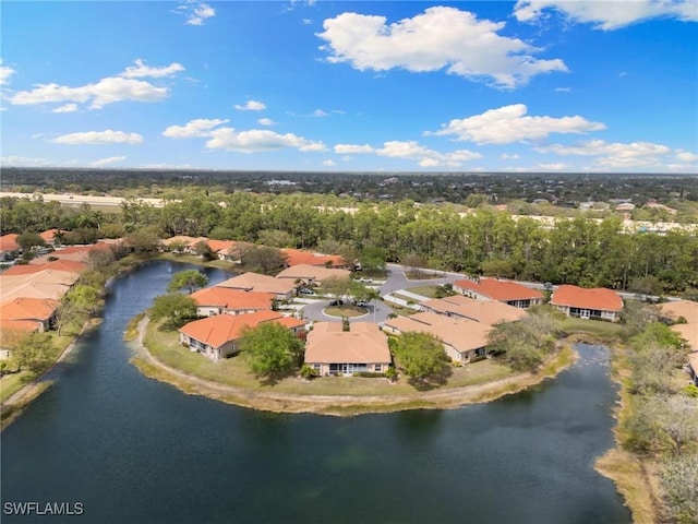 drone / aerial view with a residential view and a water view