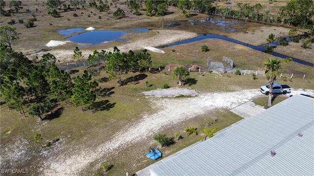 drone / aerial view featuring a water view and a rural view