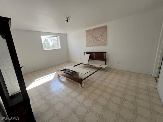 unfurnished living room featuring light floors