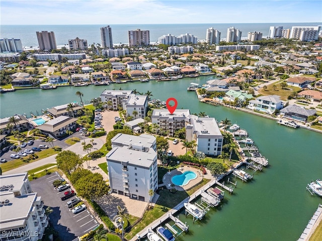 aerial view featuring a water view and a city view