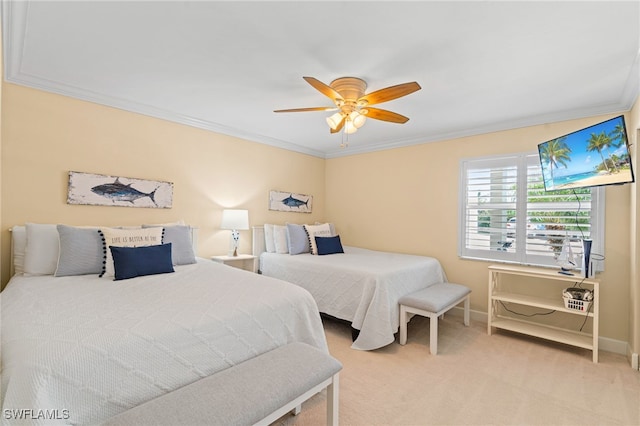 bedroom featuring ceiling fan, carpet floors, baseboards, and crown molding