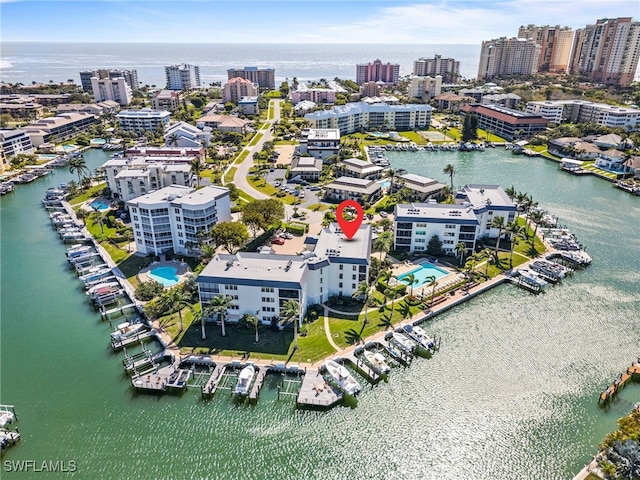 bird's eye view featuring a view of city and a water view