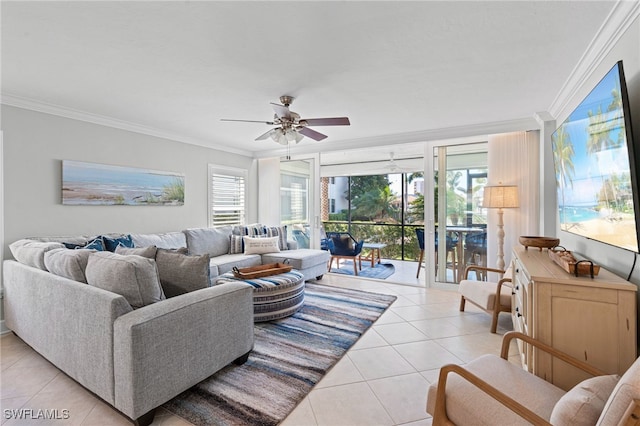 living area featuring ornamental molding, light tile patterned flooring, and a ceiling fan