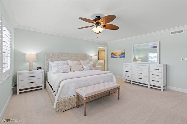 bedroom featuring crown molding, light colored carpet, visible vents, ceiling fan, and baseboards