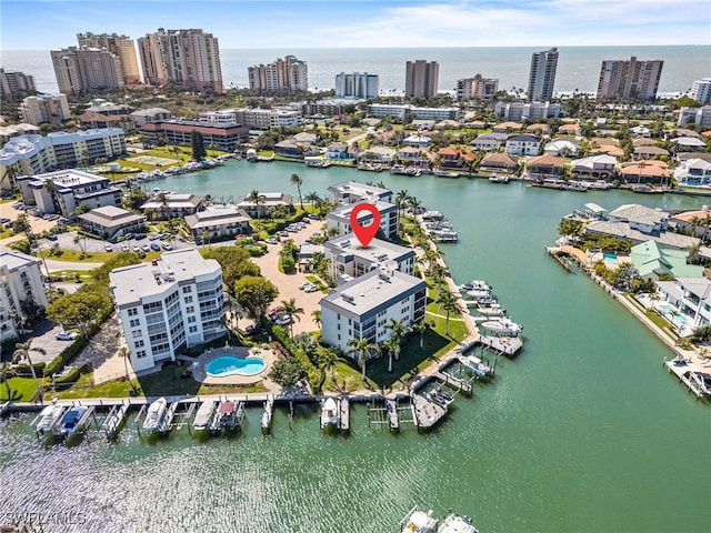 drone / aerial view with a water view and a view of city