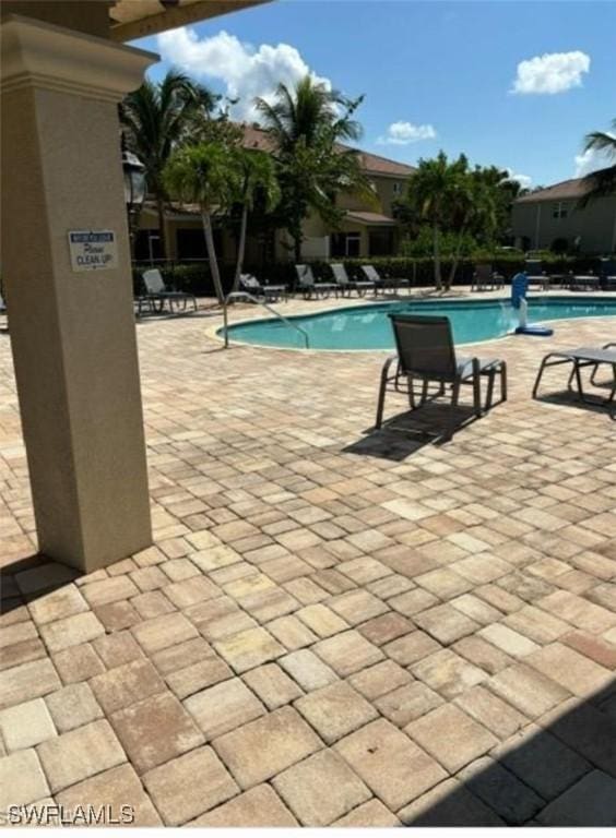 community pool featuring a patio area