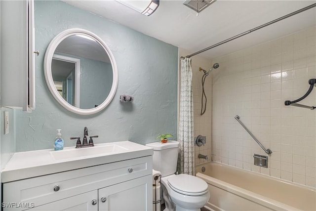 bathroom with shower / bathtub combination with curtain, a textured wall, vanity, and toilet