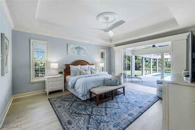 3311 Creekview Dr, Bonita Springs, FL 34134 - bedroom with a raised ceiling, access to exterior, multiple windows, and crown molding