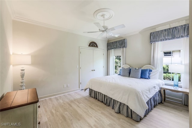3311 Creekview Dr, Bonita Springs, FL 34134 - bedroom with light wood-type flooring, crown molding, a closet, baseboards, and ceiling fan