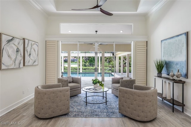 3311 Creekview Dr, Bonita Springs, FL 34134 - living room featuring ceiling fan, ornamental molding, wood finished floors, and baseboards