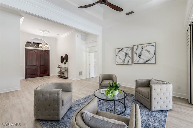 3311 Creekview Dr, Bonita Springs, FL 34134 - living room with wood finished floors, ceiling fan, ornamental molding, a chandelier, and baseboards