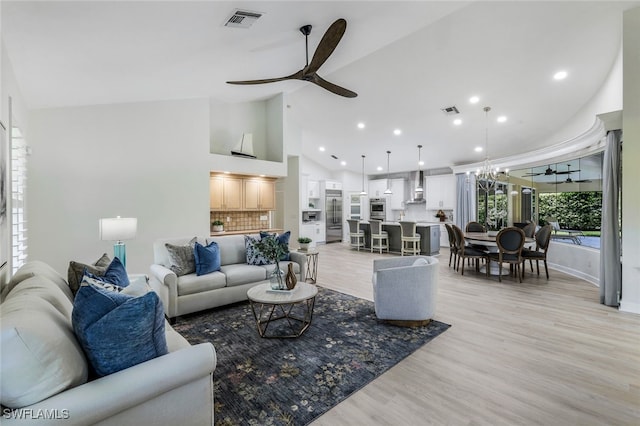 3311 Creekview Dr, Bonita Springs, FL 34134 - living area with a ceiling fan, light wood-type flooring, high vaulted ceiling, recessed lighting, and baseboards