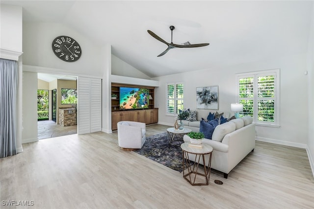 3311 Creekview Dr, Bonita Springs, FL 34134 - living room with a ceiling fan, baseboards, wood finished floors, and high vaulted ceiling