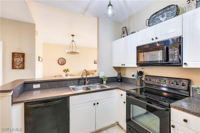 kitchen with black appliances, a sink, dark countertops, a peninsula, and white cabinets