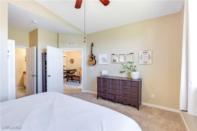 bedroom with visible vents, baseboards, light colored carpet, and a ceiling fan