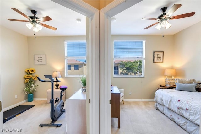 carpeted bedroom featuring ceiling fan and baseboards