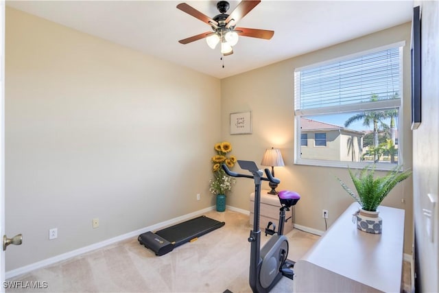 workout area with baseboards, carpet floors, and ceiling fan