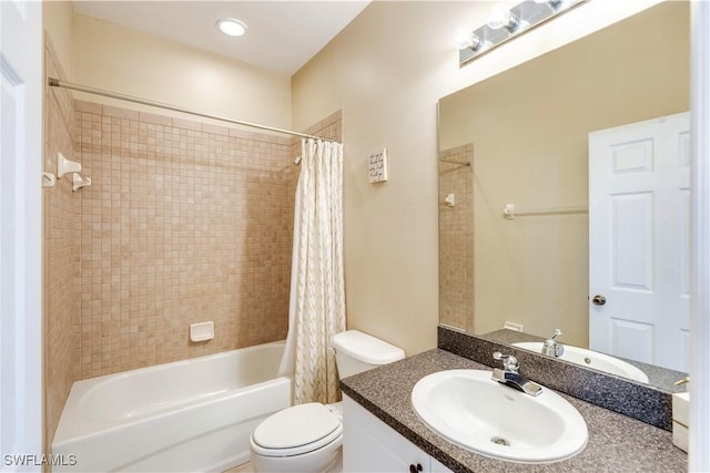 full bathroom featuring vanity, shower / bath combination with curtain, and toilet