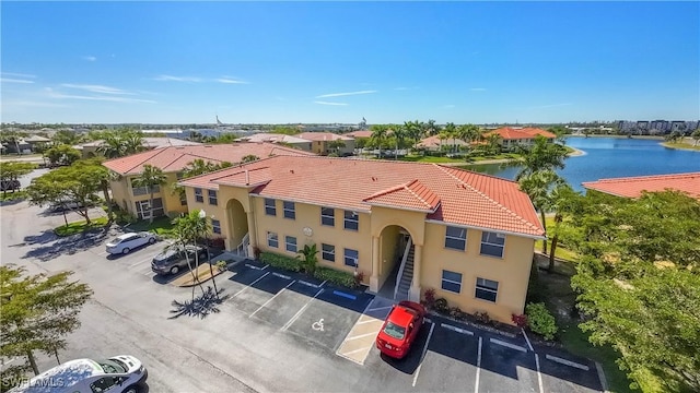 aerial view featuring a residential view and a water view