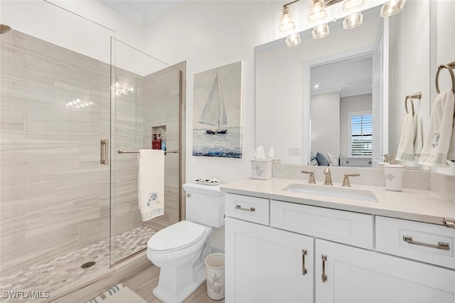 full bathroom featuring toilet, a stall shower, ensuite bath, and vanity