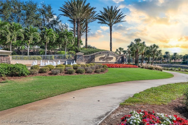 view of home's community featuring a lawn