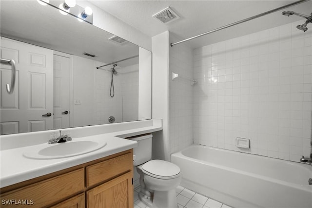 bathroom with bathtub / shower combination, visible vents, toilet, vanity, and tile patterned flooring