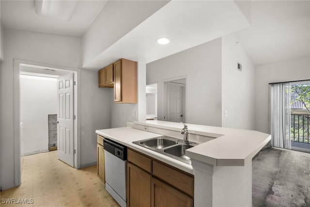 kitchen featuring dishwasher, light countertops, a peninsula, and a sink