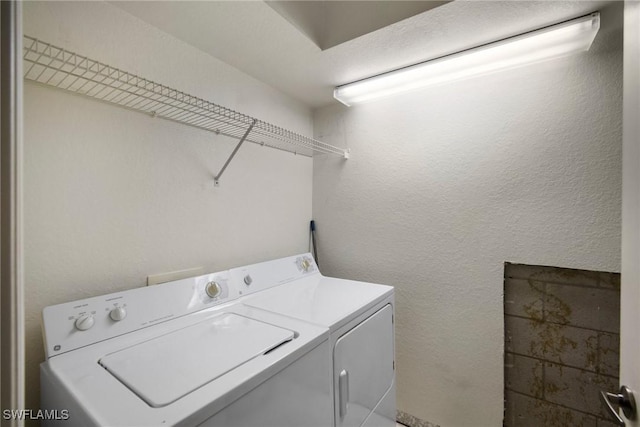 laundry room featuring laundry area and washing machine and dryer