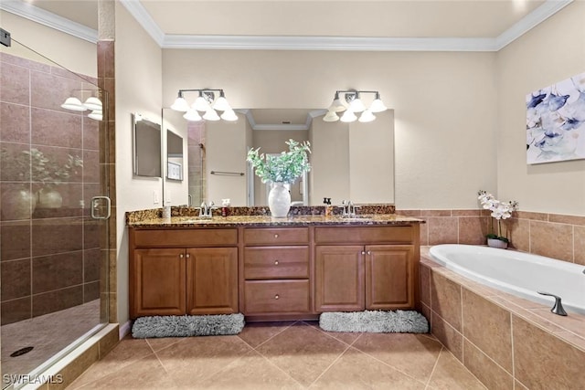 full bath with a shower stall, tile patterned floors, ornamental molding, a bath, and a sink