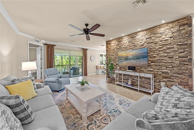 tiled living area with ornamental molding, visible vents, and ceiling fan