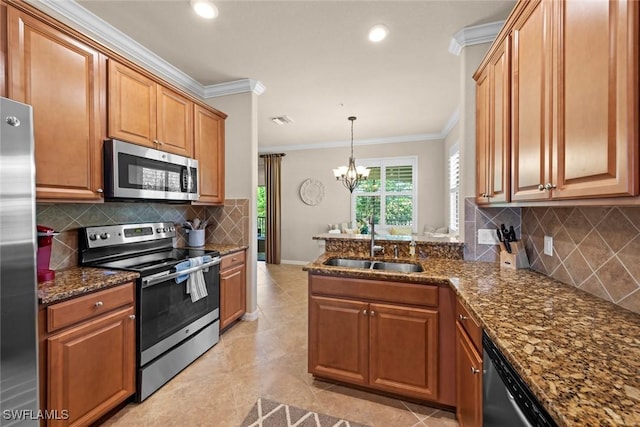 kitchen with a sink, appliances with stainless steel finishes, a peninsula, and crown molding