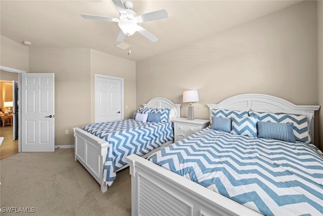 bedroom featuring light colored carpet, baseboards, and ceiling fan