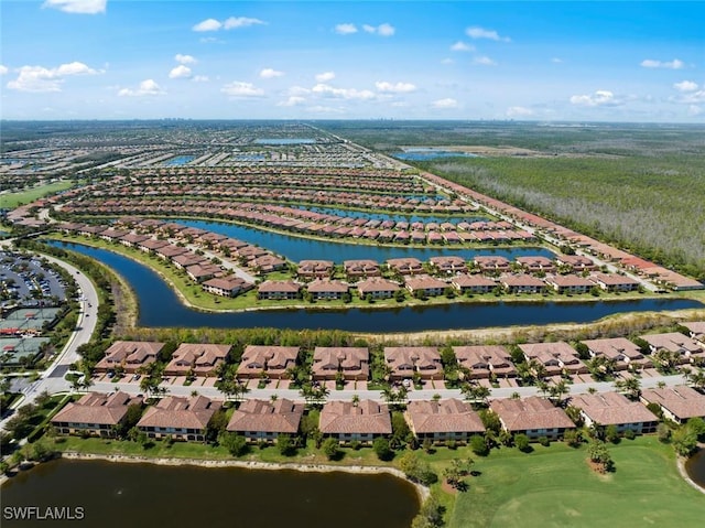 birds eye view of property with a residential view and a water view