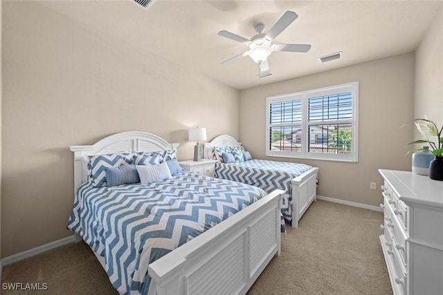 bedroom with visible vents, light carpet, baseboards, and a ceiling fan