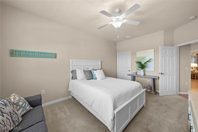 bedroom featuring a ceiling fan, visible vents, light colored carpet, and baseboards