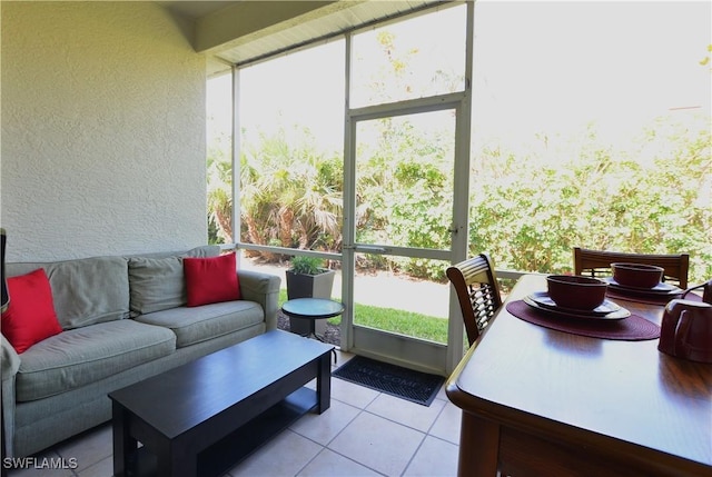 sunroom / solarium featuring an outdoor hangout area and a healthy amount of sunlight