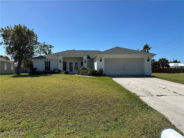 view of front of house with an attached garage, stucco siding, a front yard, and french doors